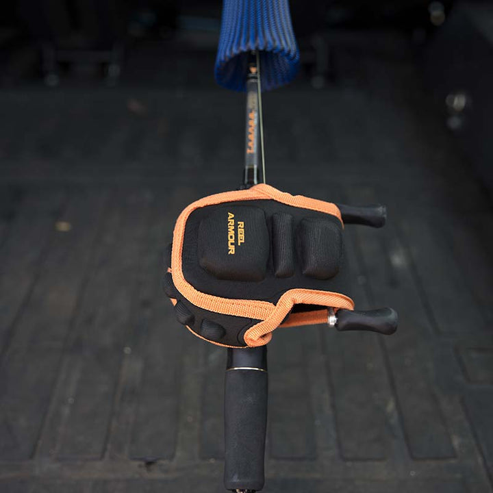 Black and orange baitcaster fishing reel protecting case