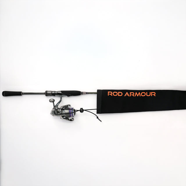 Spinning rod and reel partially inserted into Rod Armour Pro sleeve, flat-lay