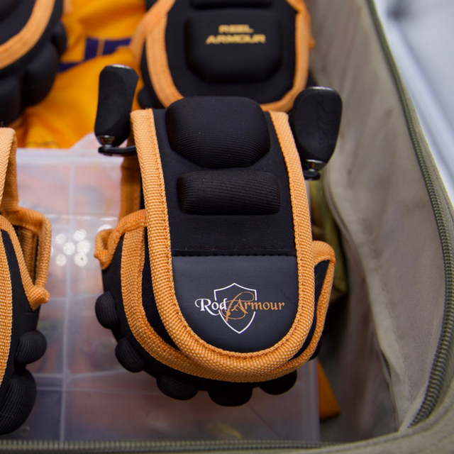 Multiple Baitcast Reel Covers organised inside a clear tackle storage box
