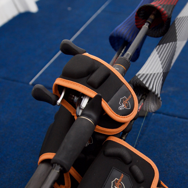 Two baitcaster rods nose-to-nose with Reel Armour covers on a boat