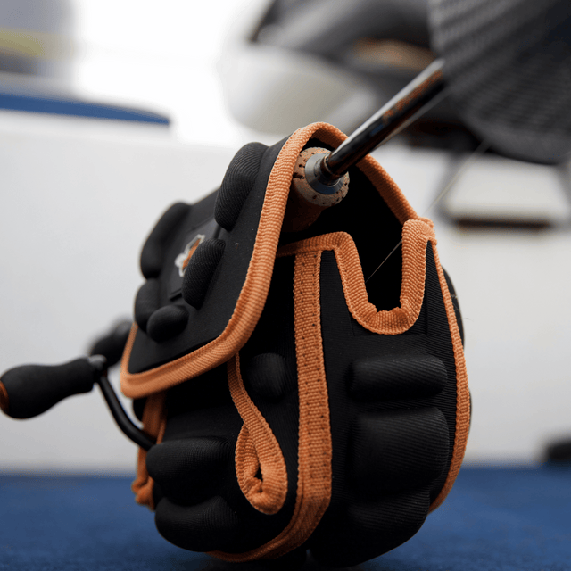 Side profile of Spinning Reel Cover photographed on a boat deck close up