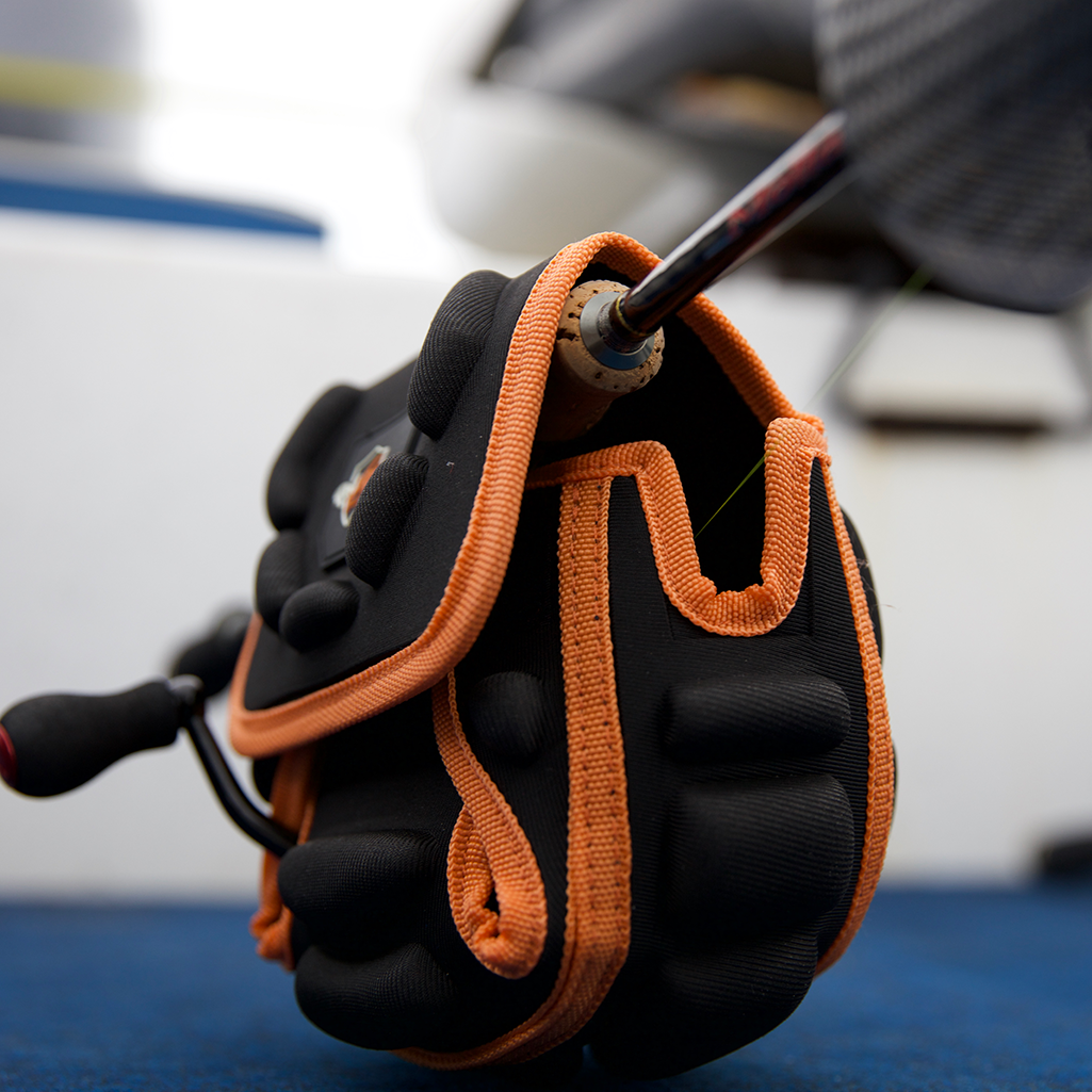 Black and orange spinning reel protective case 